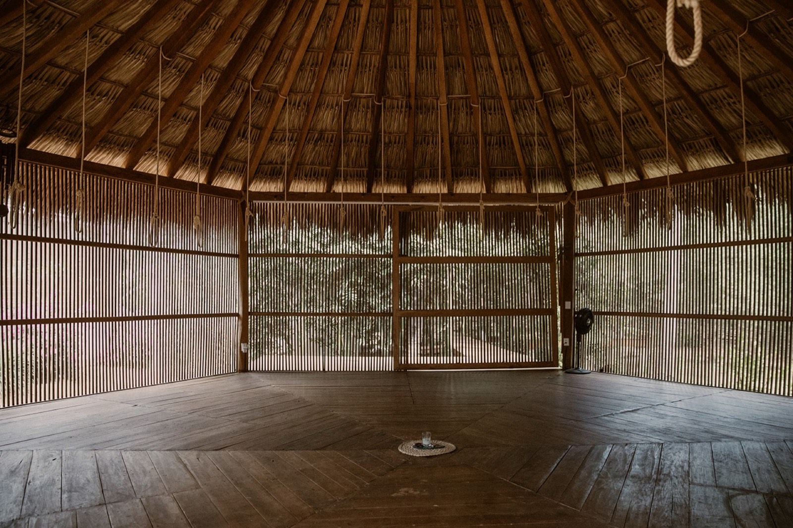 Yoga shala interior — bamboo walls and wood floor
